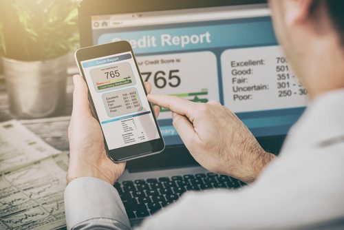 Young man checking his credit score online