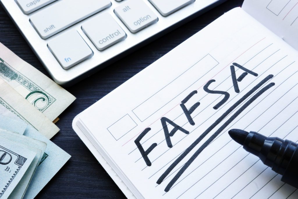 FAFSA in a notebook to apply for Student Loans
