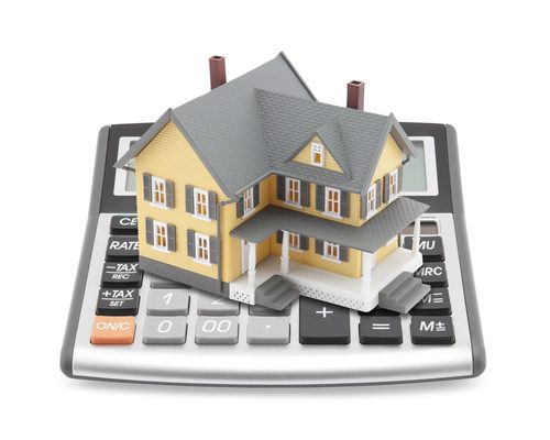 House on top of a mortgage calculator